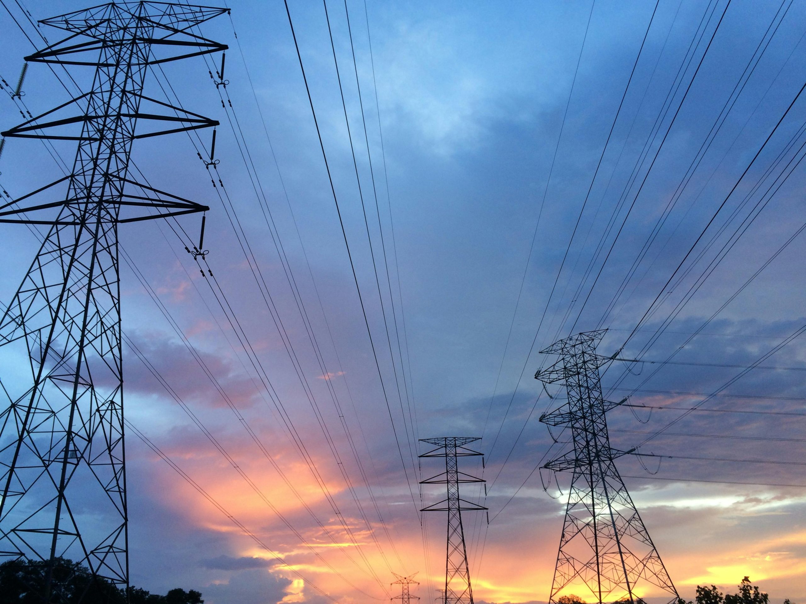 Power lines in the evening with cloudy sky